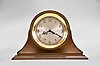 Chelsea Clock Co., Boston, Mass., "Ship's Strike" shelf clock, 8 day, time and ship's bell strike, spring driven movement in a round brass case with silvered metal 10 inch special dial with applied brass numerals set on a mahogany base
