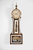 Massachusetts, possibly Stephenson, Howard & Davis, Boston, Mass. 8 day, time and strike weight brass movement patent or banjo timepiece. The use of a three pillar design with two access holes through the front plate leads to the attribution. See "Willard's Patent Time Pieces by Paul J. Foley", Pg. 155.