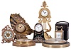 Clocks- 7 (Seven) Desk and Small Wall: lot includes: time only miniature carriage clock in case; Ansonia desk clock with metal case and porcelain dial; pocket watch holder with serpents and a Swiss watch permanently installed; watch movement in miniature drum-head mounted on green stone base; novelty clock in the form of a butterfly; wall clock with silvered dial and Swiss watch movement; wall clock with white enamel chapter ring, blue dial center with a pair of static jacquemart figures.