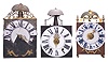 Clocks- 3 (Three) Comtoise wall clocks: (1) France, Comtoise clock, 8 day, time and strike, weight driven movement with verge escapement, thread suspension with rear-hanging pendulum in an iron post and plate frame, 9 inch faience dial with large Roman numerals, single brass hand, flat pierced brass fronton, two pivoted brass winding arbor shutters, mid 18th Century. (2) France, Comtoise wall clock, 8 day, time and strike with alarm, weight driven movement with verge escapement, thread suspension with rear-hanging pendulum in an iron post and plate frame, 8.5 inch enamel dial with flat center and convex chapter, large Roman numerals, and single brass hand, mid 18th Century. (3) France, Comtoise "lantern" clock, 8 day, time and strike, weight driven movement with verge escapement, thread suspension with rear-hanging pendulum outside the plate in an iron post and plate frame, 7.75 inch faience dial with large Roman numerals in dark blue, single brass hand, resting on turned brass feet, topped by flat brass fronton flanked by two turned brass finials, two pivoted brass winding arbor covers, mid 18th Century.