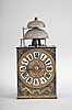 France, Comtoise clock, 8 day, time and strike with alarm, weight driven movement with verge escapement, thread suspension with rear-hanging pendulum in a iron post and plate frame, cast brass dial with a profile of Prince Louis, Dauphin of France surrounded by laurels and fleur de lis, inset white enamel cartouches with Roman numerals, single pierced iron hand, applied brass fleur de lis spandrels above the dial and pivoted winding arbor shutters below, and brass plaque stamped with the words "FAIT POUR JEAN BAPTISTE RIPOZ A COMARET ".