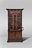 Polyphon Musikwereke, Leipzig, Germany, "Polyphon Orchestrion II" or "Polyphon Rossini" Upright Music Box, piano with drum and trap effects model, coin operated, weight driven, playing 73 note cylinder rolls containing 3 tunes each, in a mahogany case with reverse painted frosted glass doors above and cabinet with two doors below resting on four casters