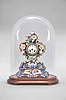 France, two-part porcelain mantel clock, 8 day, time and strike, pendule de Paris movement with silk thread suspension, the case in the style of Jacob Petit, decorated with molded and brightly painted naturalistic ornament, blue ground highlighted by bright gilding, white enamel dial with Roman numerals, Breguet style steel hands, all resting on a wood base under a glass dome