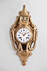 Goyer, a Paris, a neoclassical gilt bronze "Aux Guirlandes" cartel clock, the cast case surmounted by an urn with ram's heads at the sides, each with a ring in its mouth suspending a laurel festoon, the festoons continuing down the case sides and terminating beneath the bezel, case sides with textile backed apertures and foliate form brass frets, bottom with Vitruvian scroll panels above a fluted incurved bracket with laurel and acanthus ornament, roman numeral, convex white enamel dial with arabic five minute markers, signed "Goyer a Paris", well made pierced and engraved hands, large, flat bottomed round movement of at least two week duration, with recoil escapement, silk thread suspension and striking on a bell, the front plate with scribed circles for train layout, front and back plates also with holes for observing depth of engagemen between wheels and pinions
