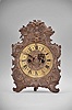 Germany, standing telleruhr, 8 day, time and strike, spring driven iron-plate movement with verge escapement and cowtail pendulum swinging in front of the dial, the movement mounted to iron plate faced with brass relief of scrolls and flowers, brass chapter ring with Roman numerals for the hours and Arabic numerals every 5 minutes, pierced brass hands.
