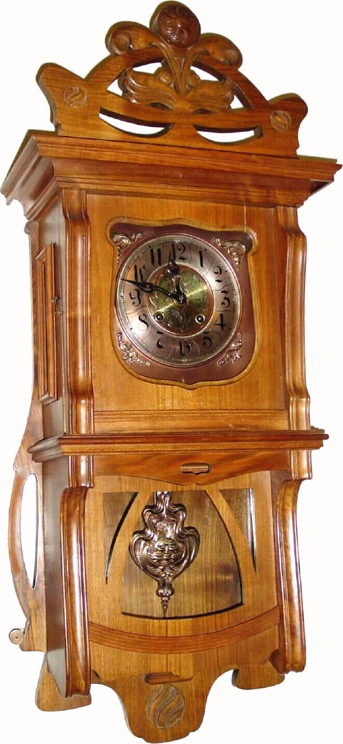 C.1910, German, Gustav Becker, Walnut wall clock in an Art Nouveau "Berliner" case with Nouveau dial, hands and pendulum, in generally good original condition. — Antique Clocks Price Guide