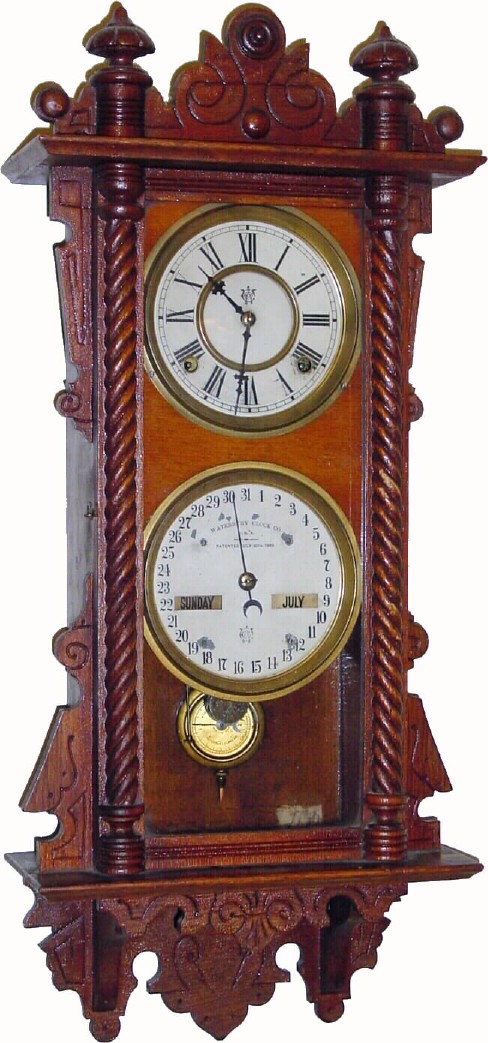 C.1891, Waterbury Clock Co., Calendar No. 36 . This is an oak double dial in excellent original condition. — Antique Clocks Price Guide