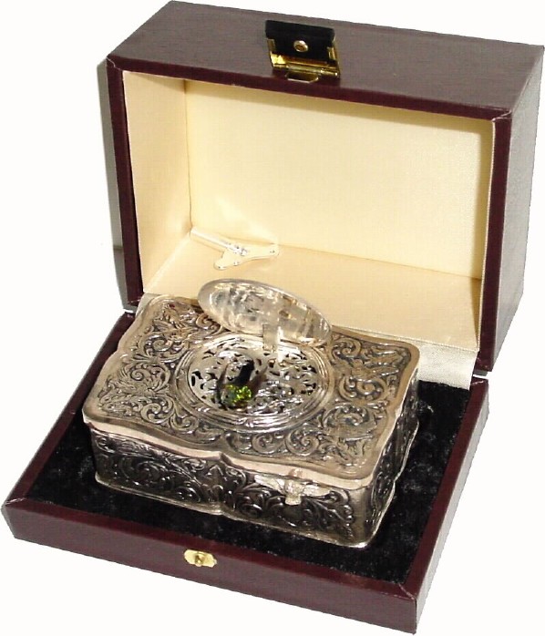 C.1980, Swiss, Reuge Music Co, St. Croix, singing bird box in an embossed sterling silver case, in original leather covered presentation box. — Antique Clocks Price Guide