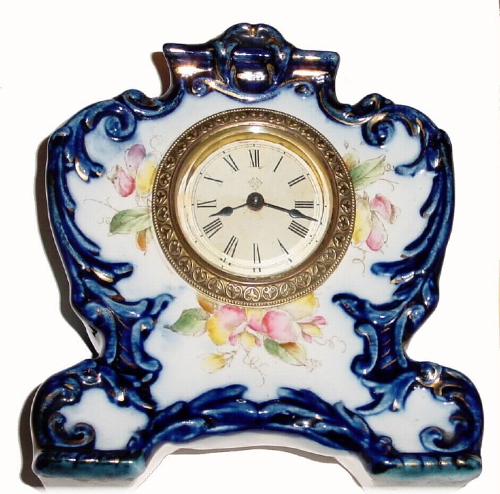 C.1904, Ansonia Clock Co., "Catbird" 30-hour porcelain timepiece in cobalt blue and in excellent original condition. — Antique Clocks Price Guide
