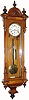 C.1870, Austrian, 1-Weight timepiece in a walnut case with canted corners and inverted finial trim.