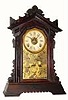 C.1885, Terry Clock Co., Pittsfield, Mass, uncommon COTTAGE model walnut gingerbread clock in excellent original condition.