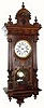 C.1900, German for the French market, a large and nicely appointed walnut wall clock in the Alt Deutsch style.
