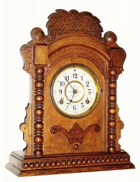 C.1893, Waterbury "VINE" oak cased cabinet clock in very good original condition. — Antique Clocks Price Guide