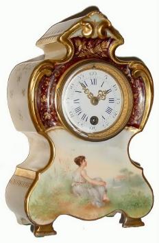C.1900, French porcelain timepiece with extremely handsome case with raised gilt decoration and painting of seated woman on front, the case sides with geometric gold decorations. — Antique Clocks Price Guide