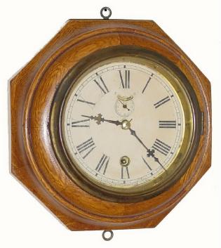C.1914, Waterbury Clock Co., 8-day lever movement wall timepiece, in an octagonal oak case with original finish. — Antique Clocks Price Guide