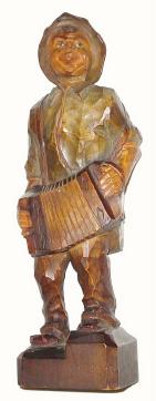 C.1935, German, Whistling Accordion Player. This is a figure of a man playing an accordion. — Antique Clocks Price Guide