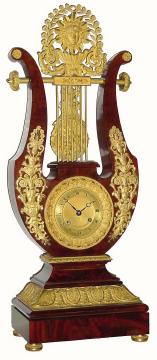 C.1860, French, Lyre Form clock, eight day striking, with fancy ormolu cornucopia pendulum that swings behind the lyre strings above the clock. — Antique Clocks Price Guide