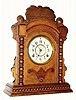 C.1893, Waterbury "VINE" oak cased cabinet clock in very good original condition.
