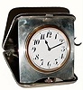 C.1900, Swiss, 1/4 Repeating, 8-day Travel clock, in a marked sterling, latching travel case with the initials JEG.