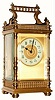 C.1900, French, Brass Cased Carriage timepiece in a fancy column case with embossed brass bands top and bottom and little turned finials within the handle.