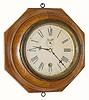 C.1914, Waterbury Clock Co., 8-day lever movement wall timepiece, in an octagonal oak case with original finish.