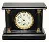 C.1910, Unknown, 30-hour time and alarm miniature black mantel timepiece.