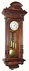 C.1880, Austrian, 3-Wt Grand Sonnerie wall clock in a walnut case with nicely carved 3/4 columns with Corinthian capitals,