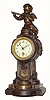 C.1910, French, Figural timepiece, surmounted by a winged cherub with a flute in his hands.