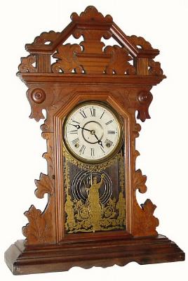C.1885, E.N. Welch Mfg Co., Walnut Gingerbread, 8-day time and strike in good condition, exceptions noted. — Antique Clocks Price Guide
