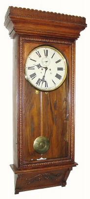 C.1905, Waterbury Clock Co., Waterbury, "Regulator No. 67" 8-day 2-weight wall clock with original grain painted weights. — Antique Clocks Price Guide