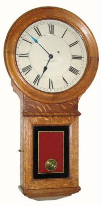 C.1910, E. Howard and Co., "Regulator No. 70", 8-day, 1-weight wall clock in oak, 12 inch dial. — Antique Clocks Price Guide