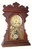 C.1890, Seth Thomas Clock Co., 8-day walnut gingerbread clock.