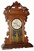 C.1885, E.N. Welch Mfg Co., Walnut Gingerbread, 8-day time and strike in good condition, exceptions noted.