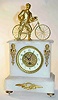 C.1900, French, Man and His Bicycle, atop a white alabaster case,