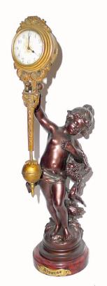 C.1905, Mixed Lot, Small French statue titled DIVERSE, with a relatively early German, Junghans swinging arm with discolored dial. — Antique Clocks Price Guide