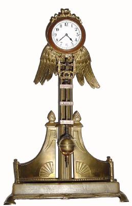 C.1905, German, Junghans, 8-Day Swinging arm clock, an unusual model on a brass stand with onyx base, — Antique Clocks Price Guide
