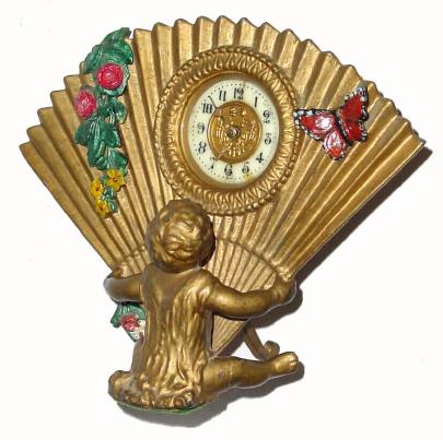 C.1904, Ansonia BABY, depicting a seated child holding mothers fan and with a butterfly setting on it. — Antique Clocks Price Guide