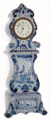 C.1905, New Haven Clock Co., Mini Delft tall clock with several chips — Antique Clocks Price Guide