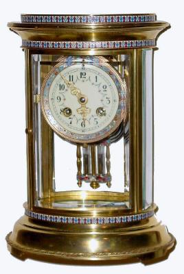 C.1900, French crystal regulator, 8-day time and strike, in an oval case with 3 bands of multi color enamel decoration going around the case, — Antique Clocks Price Guide