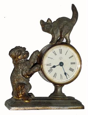 C.1880, Ansonia DUET, small cast novelty with dog and cat and in very good original condition. — Antique Clocks Price Guide