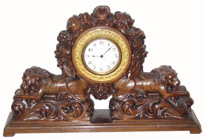 C.1900, French for the English market, carved walnut reclining lions, — Antique Clocks Price Guide