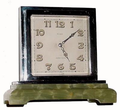 C.1935, Swiss, 8-Day Partners Desk clock in an Art Deco case of nickeled brass with a stepped onyx base, — Antique Clocks Price Guide