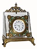 C.1900, Swiss, Ladies Desk Clock, polished crystal polygon with ormolu feet in the shape of winged lions, with a key wind bar type 30 hour watch movement.