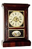C.1870, Jerome and Co., (New Haven) , 30-Hour rosewood cottage clock with guttu purcha or thermo-plastic inserts in the door.