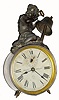C.1905, Ansonia, ECHO, animated alarm clock; the boys arm holds a hammer which beats on the bell when it alarms.