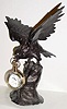 Mixed lot: C.1900, cast white metal American Eagle clock holder, now with a C.1990, foreign paperweight clock, not running.