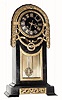 C.1900, German, Lenzkirch, Brass and Bronze cased mantel clock in with unique ribbon and acanthus garland motif.