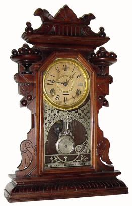 C.1890, Waterbury Clock Co., 8-day time &amp; strike walnut Gingerbread in generally good as-found condition. — Antique Clocks Price Guide