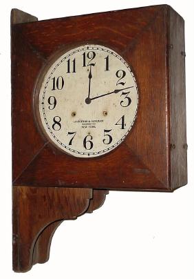 C.1922, Seth Thomas "DOUBLE DIAL", with wall bracket in oak and in generally fair original condition. — Antique Clocks Price Guide