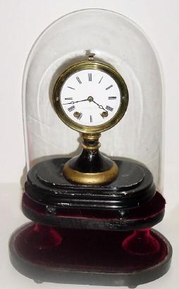 C.1870, Seth Thomas Sons &amp; Co., New York, 8-day candle stick timepiece, on sub base with old dome (larger than original). — Antique Clocks Price Guide